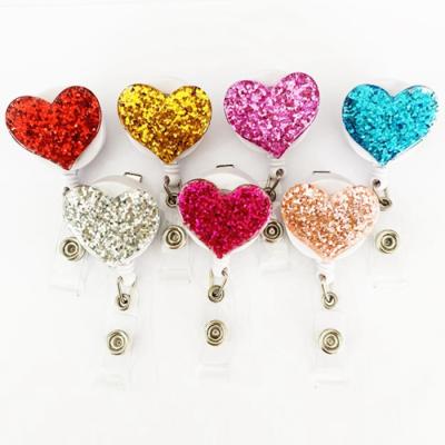 China 360 Degree Swivel Clip Diamond Heart Badge Retractable Nurse Custom Logo for sale