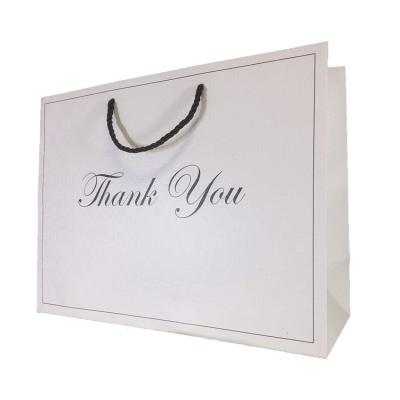 China Competitive Price Recyclable Elegant Custom Logo Shop White Cardboard Shopping Paper Gift Bags for sale