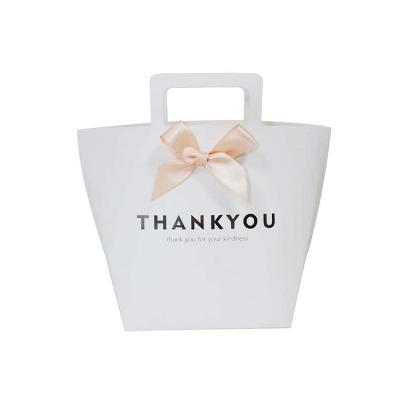 China Wholesale Recyclable Custom Die Cut White Handle Paper Bags Gift Bags With Bow Ribbon for sale