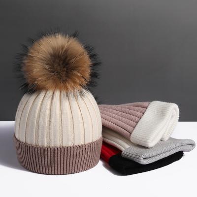 China Large real raccoon autumn and winter plush wool ball woolen woolen ball super hat women's fur hat thickened soft warm knitting hat for sale