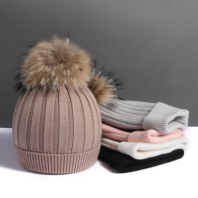 China Large real raccoon autumn and winter plush wool ball woolen woolen ball super hat women's fur hat thickened soft warm knitting hat for sale