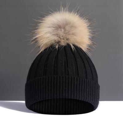 China Large real raccoon autumn and winter plush wool ball woolen woolen ball super hat women's fur hat thickened soft warm knitting hat for sale