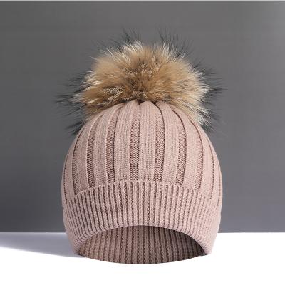 China Large real raccoon autumn and winter plush wool ball woolen woolen ball super hat women's fur hat thickened soft warm knitting hat for sale