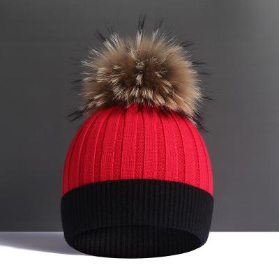 China Large real raccoon autumn and winter plush wool ball woolen woolen ball super hat women's fur hat thickened soft warm knitting hat for sale