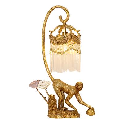 China Retro Style French Brass Luxury Monkey Pedestal Table Lamp With Crystal Tassel Lampshade Classical Bedroom Bedside Lamp for sale