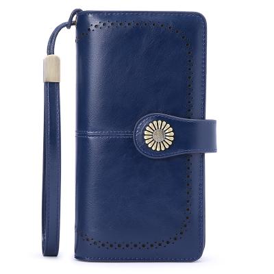 China Genuine Leather Large Capacity RFID Clutch Holder Travel Purse Wristband Women's Wallets for sale