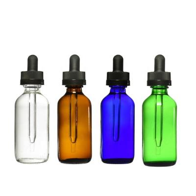 China Cosmetic Manufacturer 2oz Black Light Blue Amber 60ml Boston Round Bottles With Child Safe Dropper for sale