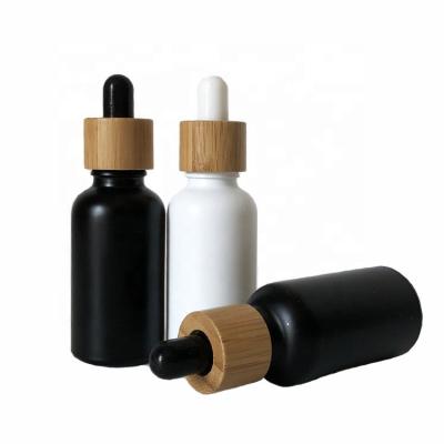 China 5ml 20ml 25ml 10ml 30ml 50ml 100ml Glass Bottle Essential Oil Lid Dropper Black Bamboo Bottle Cosmetic Manufacturer for sale