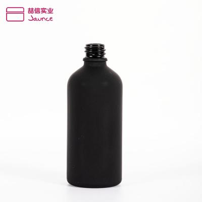 China Custom Printing Matte Black Cosmetic Packing 15ml 30ml 50ml 100ml Personal Care Round Shape Essential Oil Glass Bottle With Cap for sale