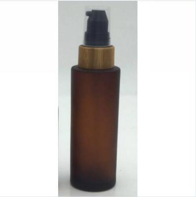 China High quality luxury personal care amber frosted glass cosmetic bottle with bamboo pump for lotion for sale