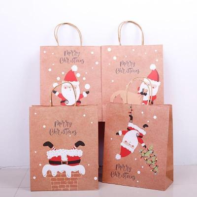 China Festival Handmade Paper Packaging Gift Bags With Handles Printing Santa Claus Christmas For Cookie Packaging Xmas Eco Friendly Paper Bags for sale