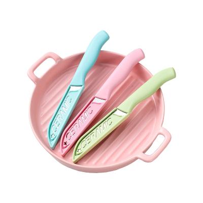 China Sustainable New candy colored ceramic blade kitchen gadget creative fruit knife with cover for sale