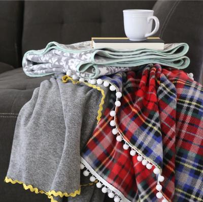 China Christmas Anti-pilling Pom Pom Holiday Fleece Blanket OEM Blanket for sale