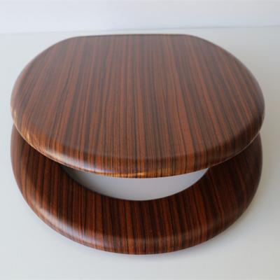 China Slow-end Toilet Seats 18' Position Molded Wood Toilet Seat Cover With PVC Sheet Strip Wood Grain for sale