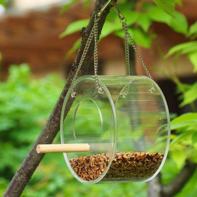 China Eco-friendly Clear Acrylic Round Bird Feeder Bird Window Aviary Hanging Kits With Metal Chain Idea For Small Wild Bird for sale