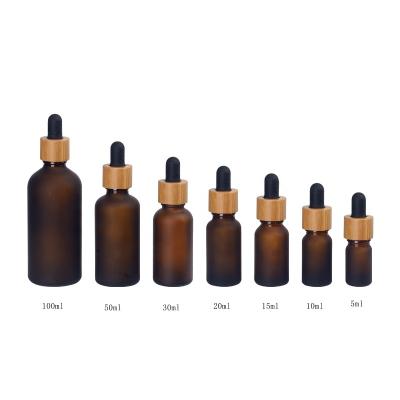 China 5 10 15 20 30 50 100ml Essential Oil Cosmetic Frosted Brown Amber Glass Bottle With Bamboo Dropper Cap for sale