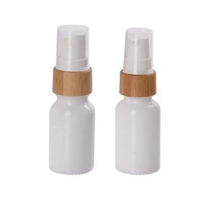 China Personal Care 10ml 10ml Bamboo Cosmetic Bottle Empty Opal White Glass Bottle With Serum Pump Spray Bamboo Pump for sale