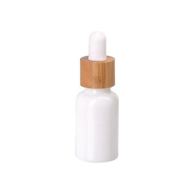 China Personal Care 15ml Bottle Packaging 15ml Cosmetic White Opal Glass Dropper Bottle With Bamboo Dropper Blank For Beautify Body Oil for sale