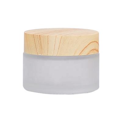 China Cosmetic 20ml Frosted Empty Cosmetic Glass Jar 20g Glass Jar Face Cream Jar Wooden Lid for sale