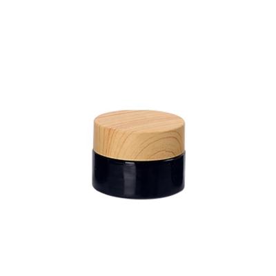 China High Quality Black Cosmetic Jar Cosmetic Empty Glass Jar 20g Face Cream Glass Wooden Lid 20ml for sale