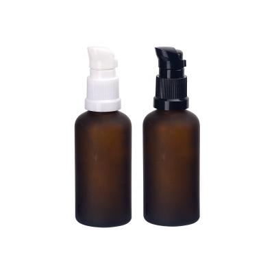 China Empty personal care frosted brown glass bottle 50ml amber glass bottle with 18mm spout plastic pump for cosmetic packaging for sale