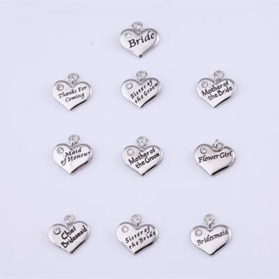 China Fashionable Jewelry Wholesale Zinc Alloy Silver Plating Letters Heart Top Hat Wedding Wine Wine Charms for sale