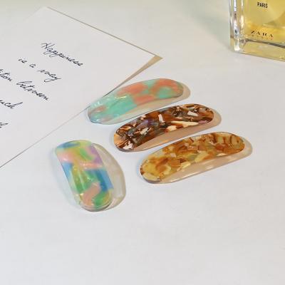 China Newest fashion summer ellipse pure color bb geometric shaped acrylic hair clips for women for sale