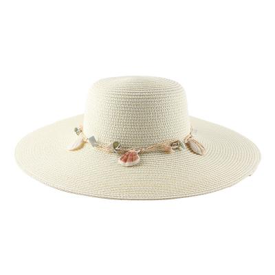 China Barred 2022 Wholesale Manufacturers Fashion Summer Wide Brim Beach Sun Protection Straw Hat With Decorative Conch Rope For Women for sale