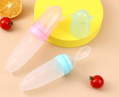 China Baby silicone rice cereal spoon milk bottle squeeze feeding spoon child silicone feeding bottle with spoon for baby for sale