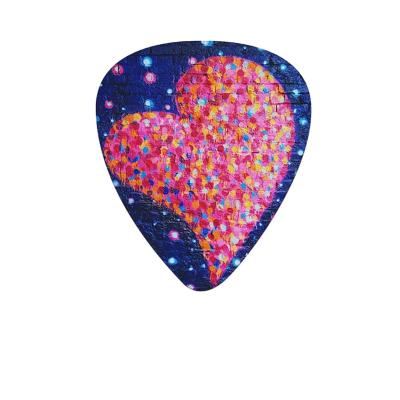 China Amazon Hotsell 0.71mm Guitar Picks GUITAR With Medium Gauge 12pcs Package Picks Holder And Plastic Picks Box Hip Hop Graffiti Themed for sale