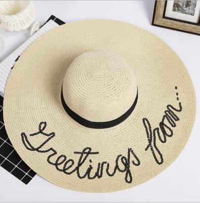 China Can put customer's logo on hat outdoor sun protection foldable straw hat wide brim ladies beach hats with letters print for sale