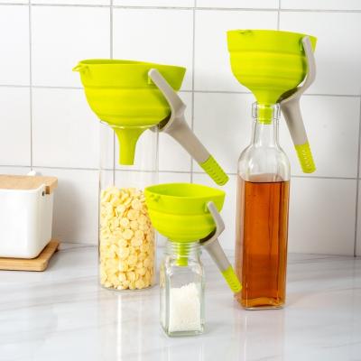 China Newest Sustainable Collapsible Kitchen Accessories Food Grade Silicone Funnel With Plastic Handle for sale