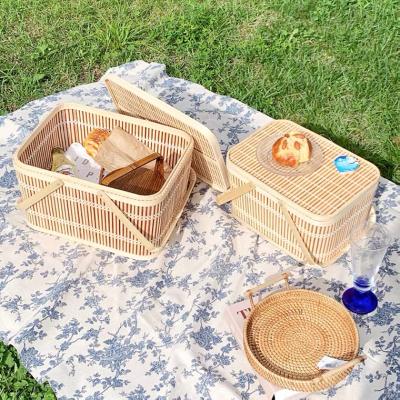 China Handwoven Farmhouse Summer Picnic Bamboo Basket Large Storage Basket With Lid Household Storage Box for sale