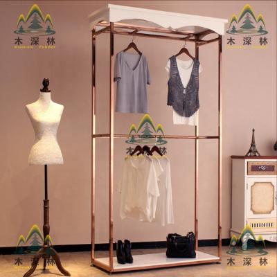 China Exquisite and luxury environment-friendly apparel display stand with pink structure and gold wood together perfect for apparel and things display for sale