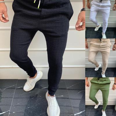 China Anti-Wrinkle Mens Solid Color Polycotton Pants Breathable Casual Drawstring Slim Fit Jogger Pants for sale