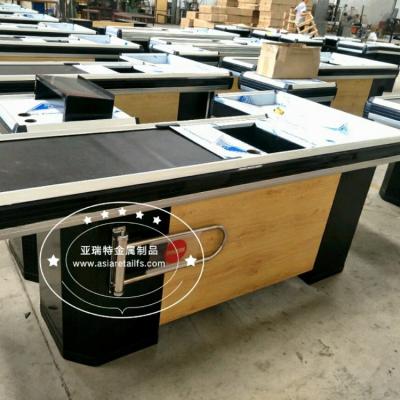 China New design cold rolled wooden steel color shopping mall motorized checkout counter with belt for sale