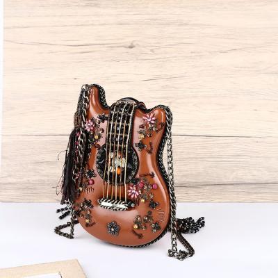 China luxury & special & special hot sale Angel Kiss style handmade unique evening clutches beaded tassel guitar ukulele shape luxury party bag for ladies for sale