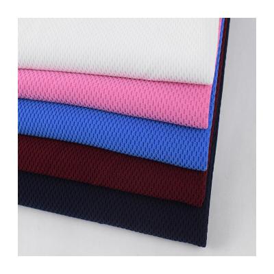 China Polyester dyed solid knitted honeycomb jacquard New Jersey mesh textile fabric for sale