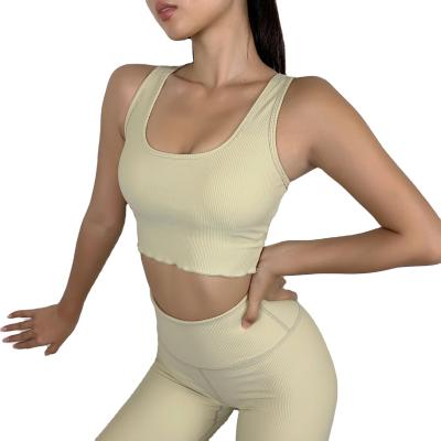 China Breathable Ribbed Yoga Sets Fintess Sports Bra And Yoga Pants Solid Color Women Seamless Fitness Clothes for sale