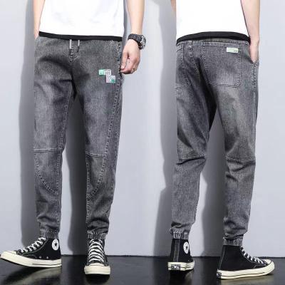 China 2021 youth breathable jeans spring and summer jeans men's loose harem pants fashionable style Korean self-cultivation feet pants for sale