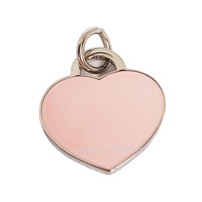 China Square And Heart Shape Worldwide Logo Debossed Metal Charm Pendant Ornament for sale