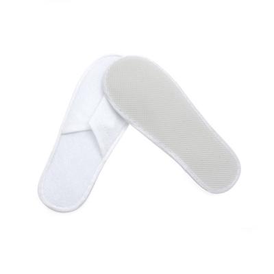 China Cheap Disposable One Time Nonwoven Fabric Hotel Nonwoven Slippers for sale