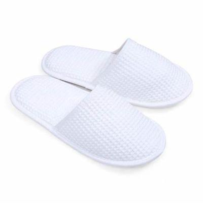 China Disposable Customized Man Logo Waffle Hotel Slippers for sale