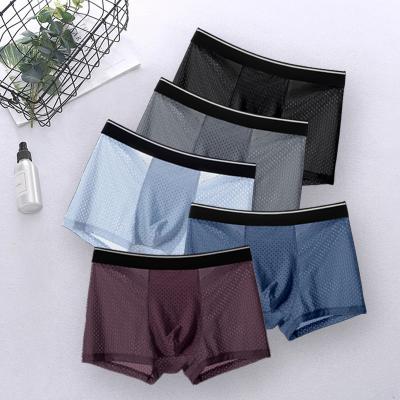 China Plus Size Men's Underwear Solid Color Mid Waist Boxer Antibacterial Full Ice Silk Mesh Shorts Breathable Hollow Boxer Briefs for sale