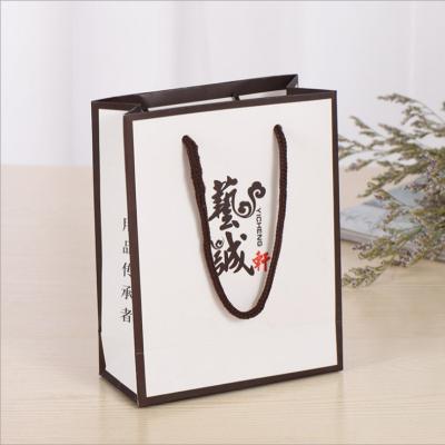 China Custom Design Black Cardboard Paper Cheap Paper Shopping Bag with Ribbon for sale