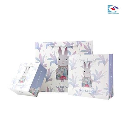 China Creative color printed rabbit pattern paperboard birthday gift packaging paper bag for sale