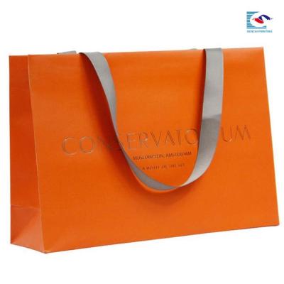 China luxury silver stamping gift apparel paper packaging bag with ribbon flat rope for sale