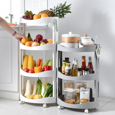 China Multifunctional Snack Stored With Wheels Household Storage Rack Small Shelf Trolley Removable Floor Universal Storage Rack Dining Trolley for sale