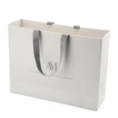 China Manufacturers Handmade Custom Packaging Bag Retail Paper Shopping Bags For Clothes for sale