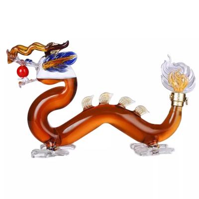 China High Quality Hand Blown Dragon Shaped High Borosilicate Glass Whiskey Decanter for sale